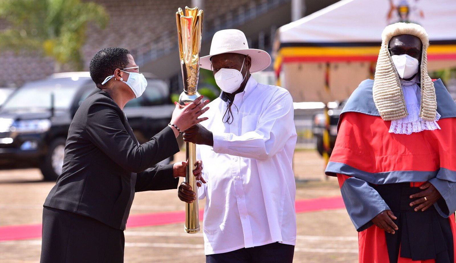  Among receives instruments of power from President Museveni.