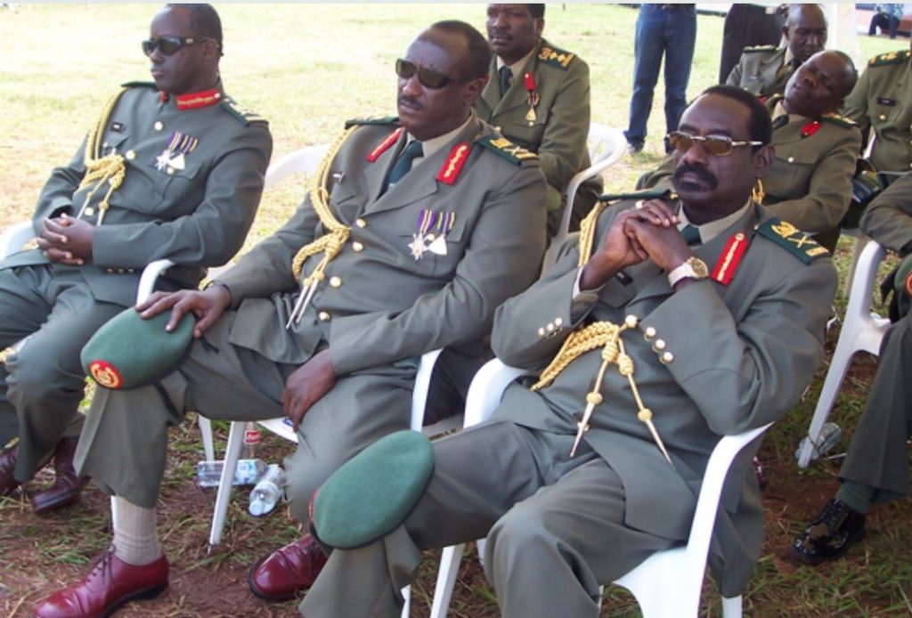 Sejusa (right) with fellow Generals Salim Saleh (middle) and Elly Tumwine (left) during a UPDF function